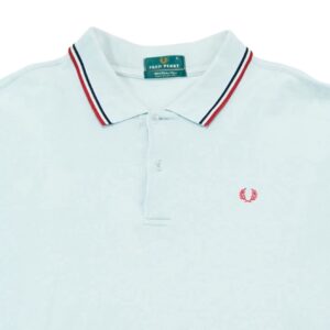 Pánské světle modré vintage polo tričko značky Fred Perry s krátkým rukávem a logem na přední straně Light Blue Polo Shirt