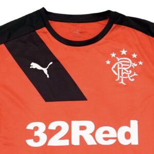 Pánský červený fotbalový dres značky Puma s krátkým rukávem a potiskem fotbalového týmu Rangers Glasgow FC.. Puma Rangers Glasgow Red Jersey