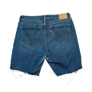 Dámské modré bootcut džínové kraťasy značky Levis 715 s nášivkou na zadní straně.. Levis 715 Blue Shorts